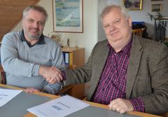 Foto af de to formænd bag aftalen