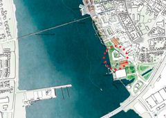 Guldborgsund Kommune kan spare 3-5 millioner kroner om året ved at flytte til lejede lokaler. Private investorer har tilbud at bygge et nyt borgerhus på havnen i Nykøbing Falster, som kommunen kan leje. Det er planen, at borgerhuset skal bygges inden for den røde cirkel på kortet. Foto: GPP Arkitekter.