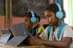 Children learn using tablets during an e-learning session at Alshargia safe learning space, Kassala, Sudan.  Alshargia safe learning space or Makanna accommodates 631 children, including both displaced and host community, and has been operational since June 2023. The space, previously used as a school, has been transformed into a makanna due to the closure of schools following the outbreak of war. The facility is supported by four facilitators and assisted by 15 dedicated volunteers.