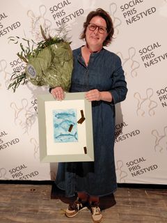 Ressourceleder Marie Louise Dilling Hansen modtog prisen på vegne af Plejehjemmet Munkebo i kategorien offentlige arbejdspladser