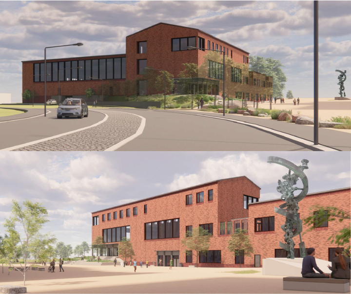 Ny bygning med rød murstensfacade, store vinduer og moderne arkitektur.