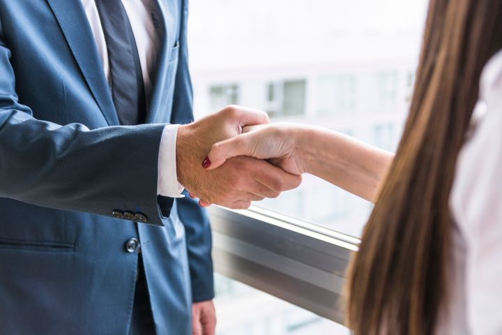 Business people shaking hands.