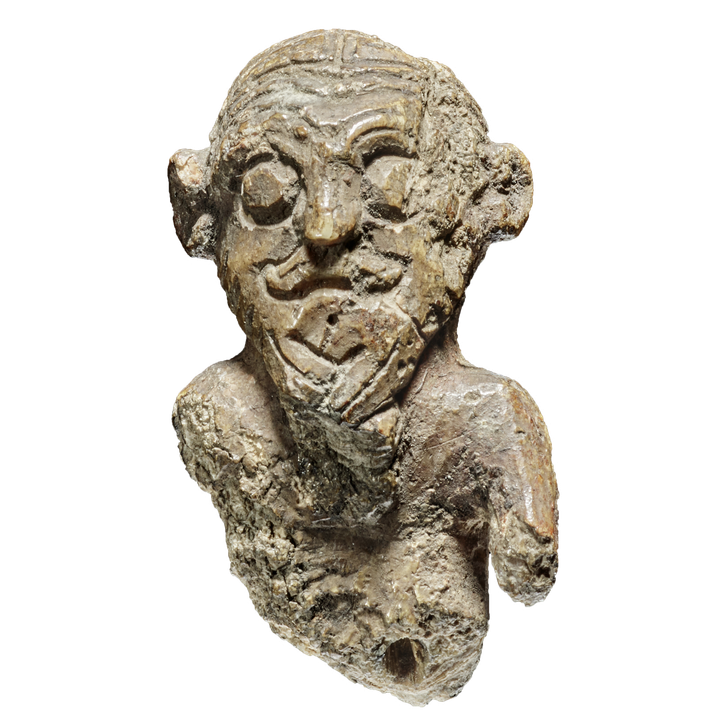 This small, unique gaming piece from the Viking Age reveals a hairstyle that was probably in vogue among Vikings at the time of Harald Bluetooth. Photo: Roberto Fortuna, the National Museum of Denmark.