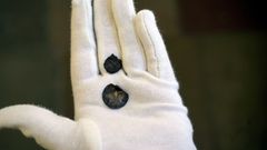 The two coins, held in a hand. Photo: John Fhær Engedal Nissen, the National Museum of Denmark.