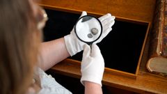 The two coins seen through a magnifying glass. Photo: John Fhær Engedal Nissen, the National Museum of Denmark.