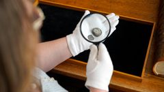The two coins seen through a magnifying glass. Photo: John Fhær Engedal Nissen, the National Museum of Denmark.
