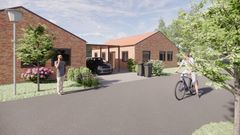 Visualisering af nyrenoveret gade i Toften, Padborg, med røde murstenshuse, træer og en cyklist på vejen.