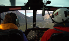 View from the cockpit of the helicopter flying over mountains