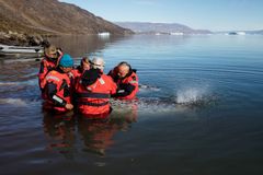 A field team tagging a narwhal.