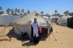 Midwife Jenin, from Khan Younis in the southern Gaza Strip, supports pregnant women from a tent she set up in the Mawasi area.