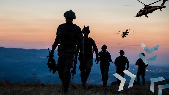 SitaWare BattleCloud logo on a group of soldiers and a helicopter at sunset