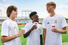 (from left to right) Álvaro Fernández Carreras, Vinícius Júnior and Dean Huijsen drinking Melitta coffee.