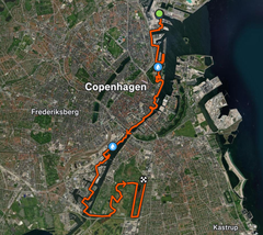 Luftfoto af løberute i København for Royal Copenhagen City Half 2026, markeret med orange og start- og slutpunkter.